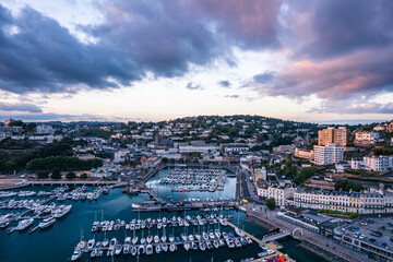 Fototapeta premium Sunset over Torquay Harbour and Marina, English Riviera from a drone, Devon, England, Europe 