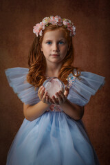 Little girl with cristal ball