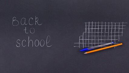 School background top view School items on a black background