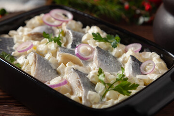 Herring fillet salad in cream with apple.