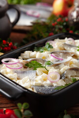 Herring fillet salad in cream with apple.