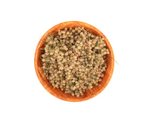 Top view of ripe white currants in a bowl over white background.