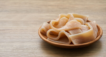 hot pot Sichuan noodles in wood plate on wooden table background. hot pot Sichuan noodles in wood plate Chinese food background                                          