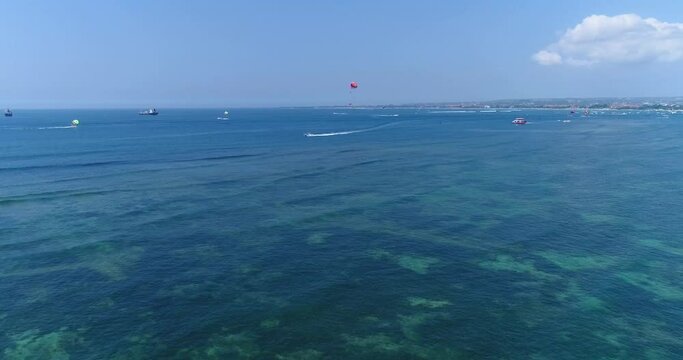 Aerial shot of parasailing in the southern part of Serangan island