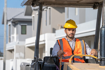 Construction worker are driving grader tractor or construction machine move the soil at the...
