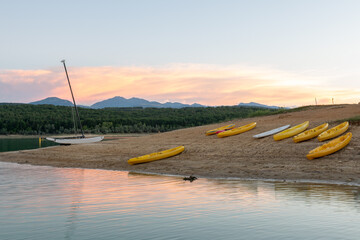 Sunset on Lake Montbel in Ariege with the boats in the summer of 2022