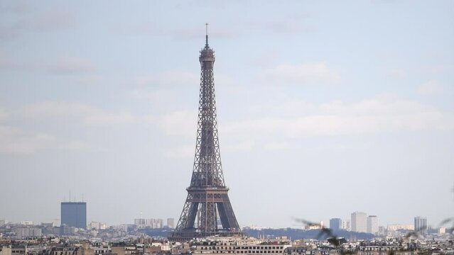 Panoramic view of Paris city with the Eiffel Tower ("Tour Eiffel"), with a blue sky during a sunny day