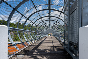 Fototapeta na wymiar A Pedestrian highway bridge in metallic structure. Picture from Rijeka, Croatia