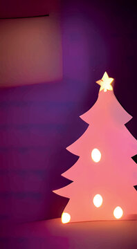 Christmas Tree With Lights And A Star Isolated On A Blurry Purple Background.