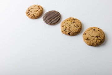 High angle view of cookies arranged on white background, copy space