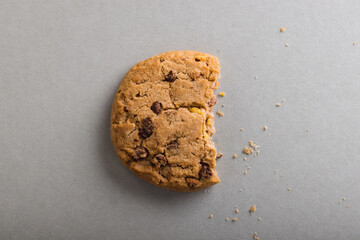 Directly above shot of half eaten cookie on gray background with copy space - Powered by Adobe