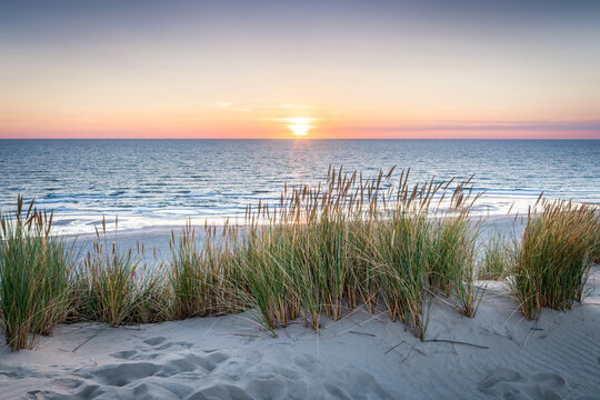 Dune beach at sunset	
