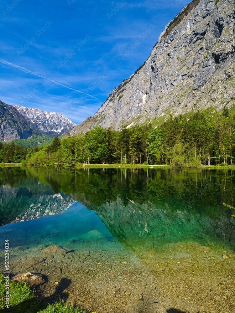 Poster beautiful view of the calm lake with reflection of trees in the water