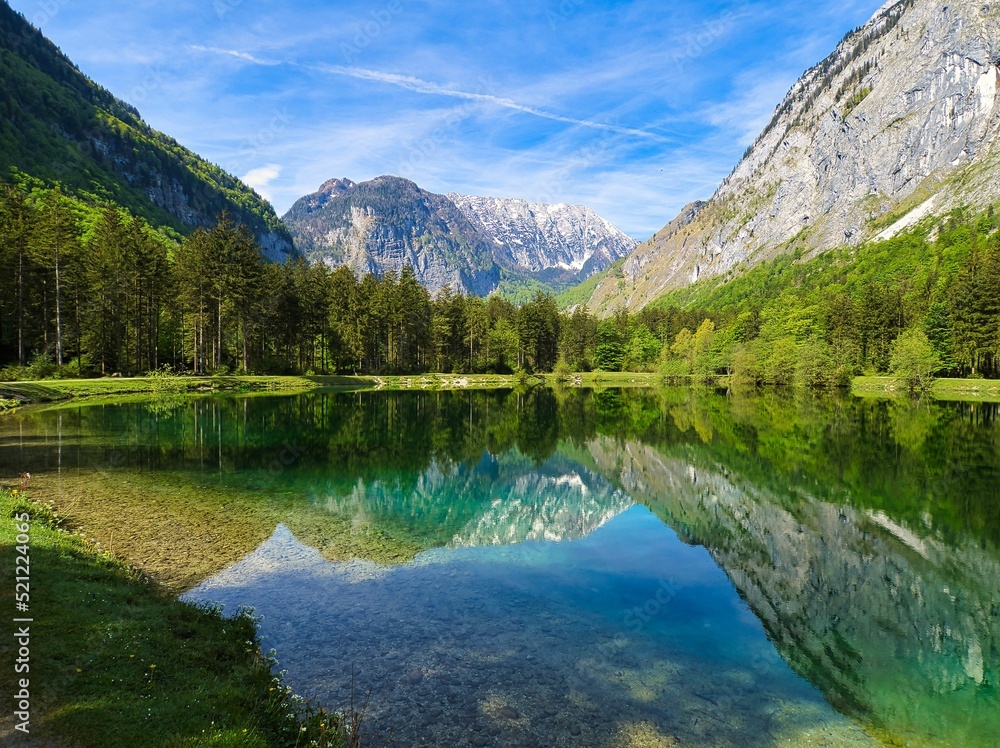 Poster beautiful view of the calm lake with reflection of trees in the water