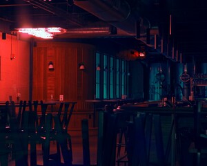 View of a closed bar interior with neon lights