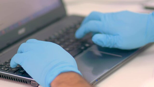 4k real time - hospital staff carrying out medical research in the laboratory with pipettes, test tubes, samples, etc...