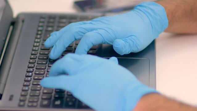 4k real time - hospital staff carrying out medical research in the laboratory with pipettes, test tubes, samples, etc...