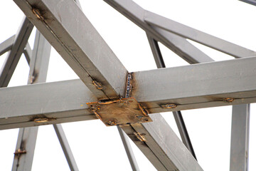 Welded steel structure on a white background.