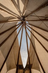 Vertical shot of the inside a Teepee © Theresa M/Wirestock Creators