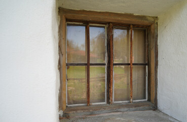 Fototapeta na wymiar Wooden window in a rustic home