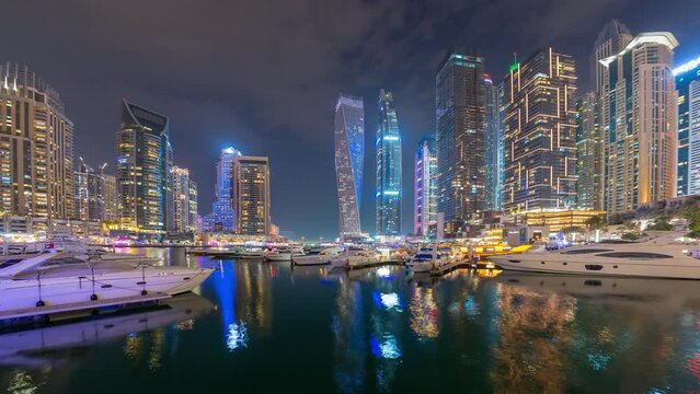 Time lapse of in Dubai Marina tourist destination at 
night .
