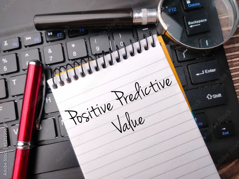 Poster magnifying glass and wireless keyboard with the positive predictive value on a notebook