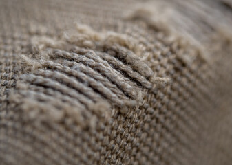 Close-up of an old cloth bag torn