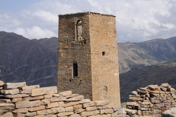 View of ancient stone watchtower in mountain village Goor, Dagestan, North Caucasus