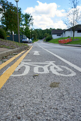 A cycle lane painted over by double yellow lines in a residential area