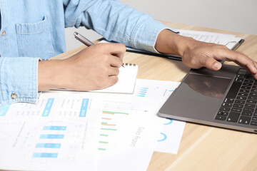 Fototapeta premium Financial charts on office desk. Home office work space. financial accounting strategy analysis concept