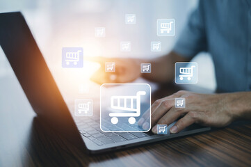 Man online store shopping on internet concept on virtual screen shopping cart