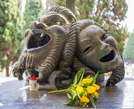 A pair of masks on the tomb of the Genoese actor of comedy Gilberto Govi, founder of the Genoese dialect theater in the monumental cemetry of Genoa, Italy.