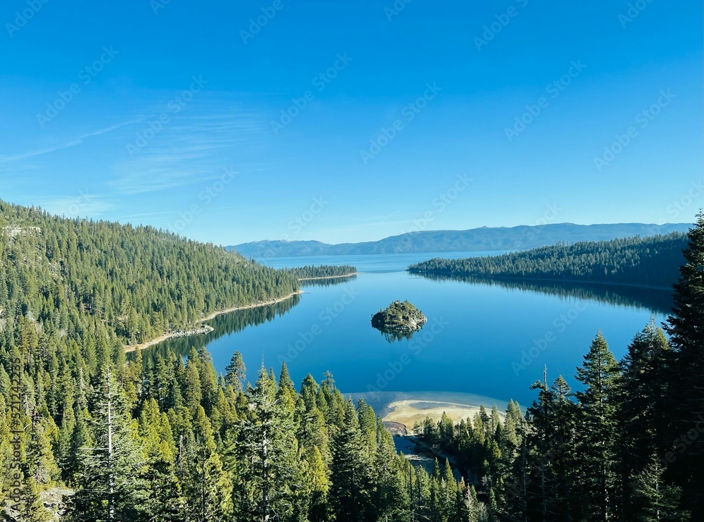 Poster beautiful view of the calm lake with reflection of trees in the water