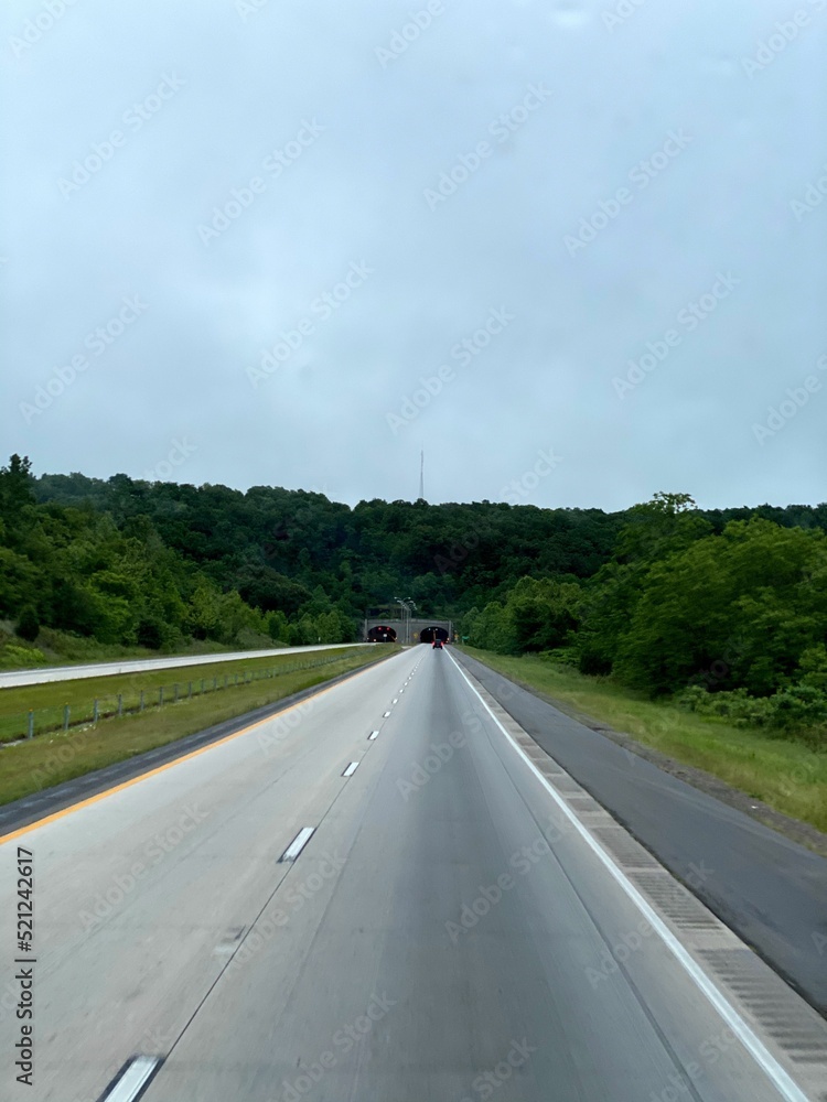 Poster beautiful view of empty highway along with autumn trees under sunlight