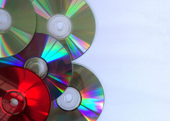 Colorful CDs against a White Background with Empty Copy Space