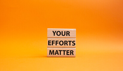 Your Efforts Matter symbol. Wooden blocks with words Your Efforts Matter. Beautiful orange background. Business and Your Efforts Matter concept. Copy space.