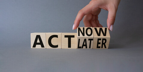 Act Now vs Act Later symbol. Businessman hand Turnes cubes and changes word Act Now to Act Later. Beautiful grey background. Business concept. Copy space