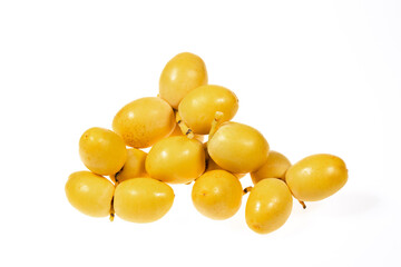 yellow raw dates isolated on white background