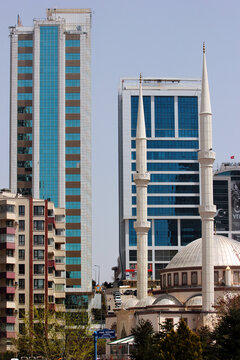 Ankara, Turkey - April 18, 2022: Firdaws Mosque and modern residential buildings in Cankaya Kizilirmak district of Ankara.