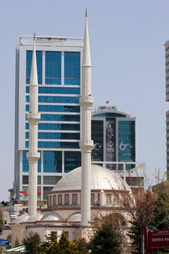 Ankara, Turkey - April 18, 2022: Firdaws Mosque and modern residential buildings in Cankaya Kizilirmak district of Ankara.