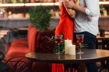 Embracing each other. Romantic couple have dinner in the restaurant