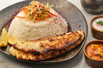 Grilled Fish With Rice served in a dish isolated on grey background side view of fastfood