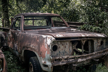 Old vintage truck car wreck used to transport ore from the mine to the steelworks. Old abandoned mining truck in old mining town area, Selective focus.
