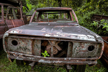 Front view old vintage truck car wreck used to transport ore from the mine to the steelworks. Old abandoned mining truck in old mining town area, Selective focus.