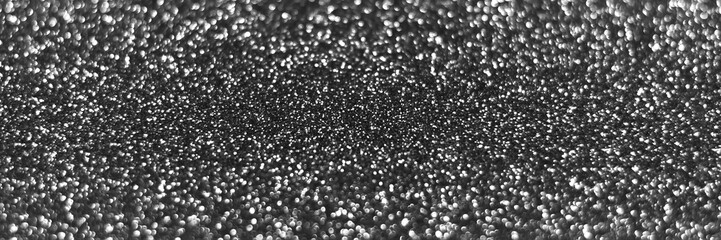 Gray silver sparkling glitter bokeh background, christmas abstract defocused texture. Holiday lights. Snowy shiny sparkle stars header. Wide screen wallpaper. Panoramic web banner with copy space