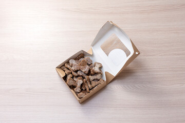 tasty treat for dogs in the form of bones in a cardboard box