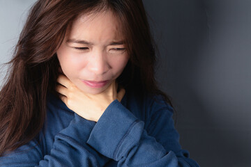 Fototapeta premium Women having a sore throat, sore throat for flu, cold, and infection