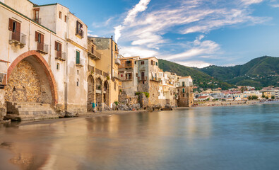 The coastline of Cefalu town on the sea wateredge in the summertime in Italy, Sicily island, Europe