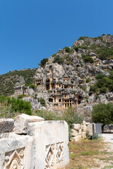 View of the Lycian tombs in the ancient city of Myra, climbed on the mountain on a sunny day.