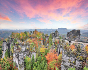 Naklejka premium Fabulous autumn landscape in Saxon Switzerland National Park and Bastei bridge.